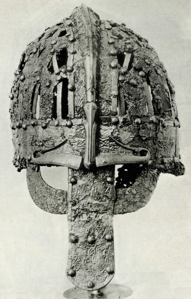 Hjelm fra det 7. århundrede, fundet i en grav ved Valsgärde. Bemærk hvordan øjenbrynene munder ud i dyrefigurer, der samtidig er en del af vingerne på en fugl (Illustration fra Greta Arwidssons bog 'Valsgärde 6' fra 1942)